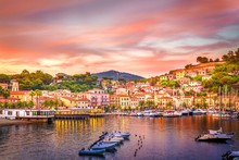 Harbor And Village  Porto Azzurro At Sunset, Elba Islands, Tuscany, Italy.