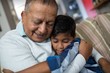 © WavebreakMediaMicro - Boy embracing grandfather