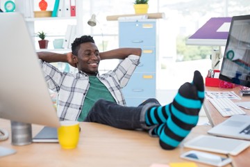 Wall Mural - Male executive relaxing at his desk