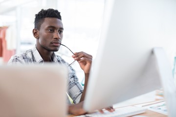 Wall Mural - Executive working on computer in office