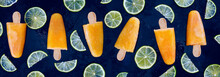Sugarless And Natural Orange Juice Popsicles With Lime Slices. Healthy Summer Dessert