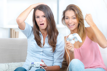 two girls play video games