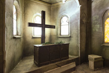 Large Catholic Cross Opposite The Windows Near The Wooden Altar In Abandoned Church