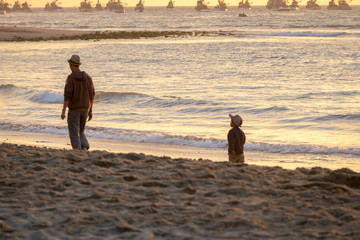 Sticker - Father and son walking at Beautiful sunset in Mancora Beach - Mancora, Peru