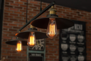 Poster - Vintage interior lighting lamp in coffee shop.