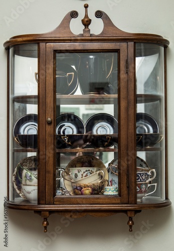 Vintage Curio Cabinet With Porcelain Tea Cup Collection Buy This
