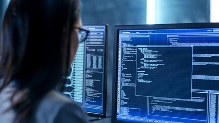 Aufkleber - Close-up Shot of Female IT Engineer Working in Monitoring Room. She Works with Multiple Displays.
