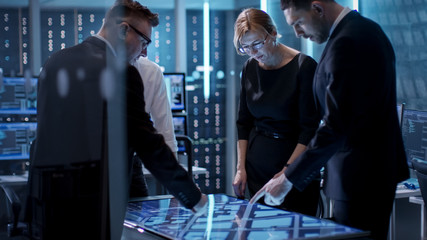Aufkleber - Government Agents Working at the Big Table in Monitoring Room. Room is Full of State of the Art Technology. Computers with Animated Screens.