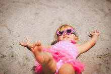 Cute Little Girl Play On Sand Beach