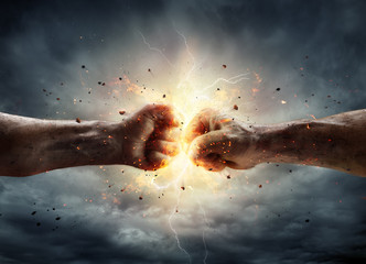 conflict concept - two fist in impact