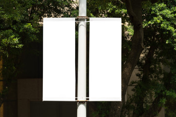 large blank billboard on a street wall, banners with room to add your own text