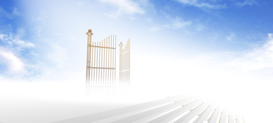 gates of heaven above stairs in fog with blue sky background