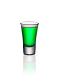 Glass shot with green absinthe isolated