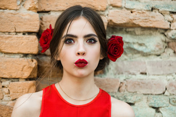 Wall Mural - fashion model with red lips and fresh roses in hair