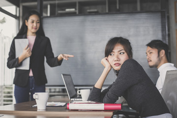 Asian business woman feeling bored for project with team meeting, vintage tone.