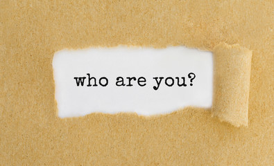 Poster - Text who are you appearing behind ripped brown paper