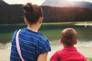 Wall Mural - Young boy and girl looking at the lake