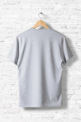 Wall Mural - Blank Grey T-Shirt Mock-up hanging on white wall, rear side view . Ready to replace your design