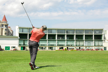 Canvas Print - Young man playing golf on course in sunny day