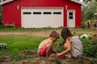 © RooM The Agency - Boy and girl playing in the dirt with a boy in the background