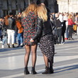 Two girls in black pantyhose