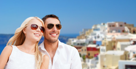 Sticker - happy couple in sunglasses over santorini island