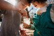 © RooM The Agency - Boy and girl holding a jar with water bugs