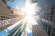© trongnguyen - Upward view of skyscrapers against a cloud blue sky in the business district area of downtown Houston, Texas, US.
