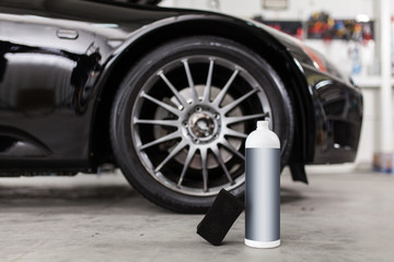 Man washing car tyres