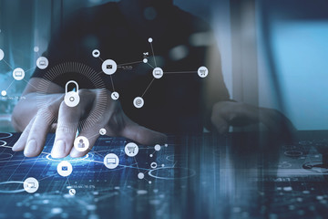 Poster - cyber security internet and networking concept.Businessman hand working with VR screen padlock icon on computer background