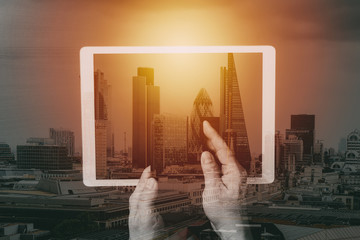 Poster - cyber security internet and networking concept.Businessman hand working on mobile phone and digital tablet computer with building exposure