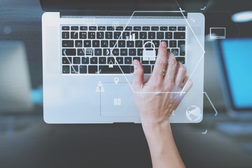 Poster - cyber security internet and networking concept.Businessman hand working with VR screen padlock icon on computer background
