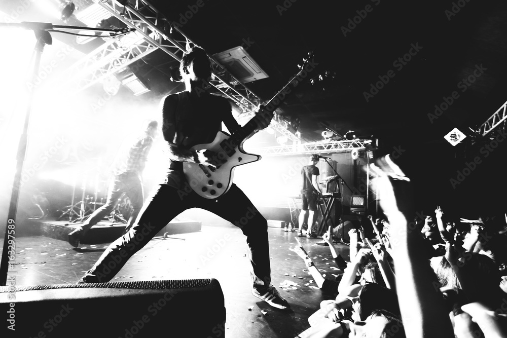 Guitarist on a stage, black and white