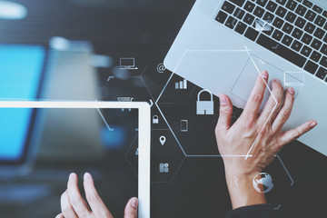 Poster - cyber security internet and networking concept.Businessman hand working with VR screen padlock icon on laptop computer and digital tablet