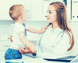 © JackF - Paediatrist woman is examining child