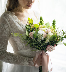 Attractive Beautiful Bride Holding Flowers Bouquet