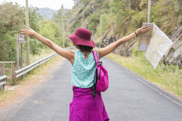 girl enjoying outdoors with arms aloft