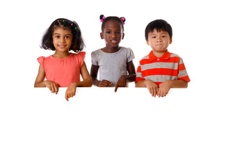 Wall Mural - Group of multiracial kids portrait with white board.Isolated