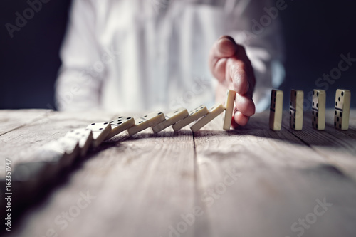 Fotomural Stop the domino effect concept for business solution and intervention