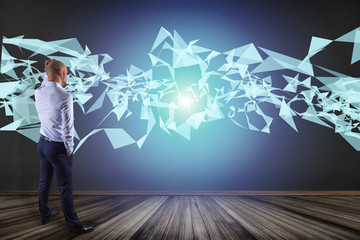 Poster - Businessman in front of a wall with Abstract triangle displayed on a futuristic interface with line and points - Technology and connection concept