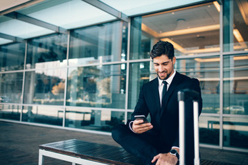 Poster - Caucasian businessman waiting in airport terminal