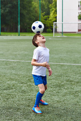 Poster - Boy soccer playing with ball