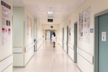 Medic Walking In Hospital Hall
