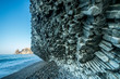 Scenic graphite rock at the seashore