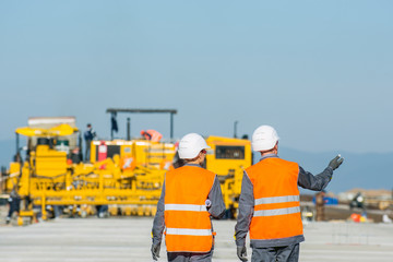 two engineers at airport runway