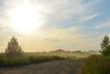 Beautiful Summer Evening Landscape: Dust Over A Rural Road And The Sun Sets, Nature, Countryside