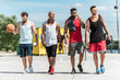 © LIGHTFIELD STUDIOS - multiethnic group of athletic basketball players walking on court