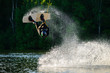man wakeboarding and jumping
