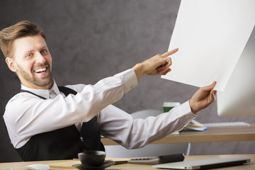 Canvas Print - Smiling businessman with project