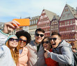 © Syda Productions - friends taking selfie by smartphone in frankfurt